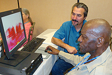 Wallace Baldwin (seated) takes computer training in Las Vegas.