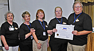 At the department’s meeting prior to the national convention, charters were presented to the recently formed Phoenix Metro Area Retiree Chapter and the Greater Las Vegas Area Retiree Chapter. From left are Las Vegas retirees Arlene Smith, Mary Handley, Pat Kasparec, and Lorraine Hedges, and local president Joe Lewis. 