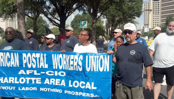 Members of the Charlotte (NC) Area Local proudly carry the union's banner in a on Labor Day.