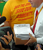Petitions were presented during a “Save the Jobs Coalition” rally that received significant news coverage. 