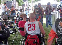 (Above) Wounded warriors take a break from the heat under the tent. (Below) Carney ready and waiting to feed the wounded warriors