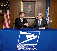 Postmaster General Patrick Donahoe and APWU President Cliff Guffey sign the union's 2010-2015 Collective Bargaining Agreement with the Postal Service. 