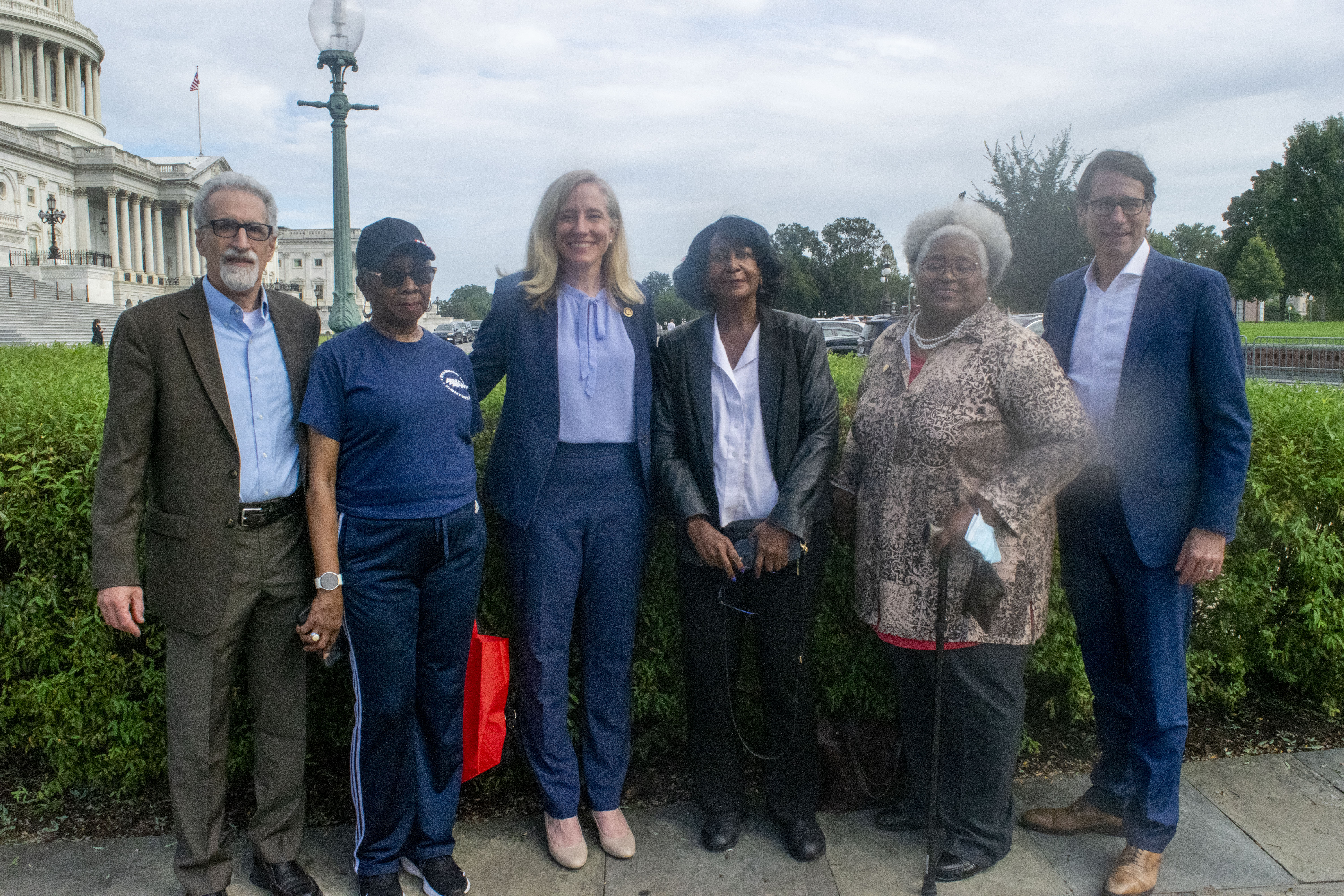 APWU Pres. Mark Dimondstein with Rep. Spanberger, Legislative and Political Director Judy Beard, and Retirees Director Nancy Olumekor