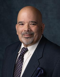 Headshot of APWU National Business Agent Hector Baez