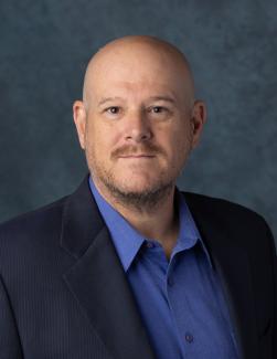 Headshot of APWU National Business Agent James "Jim" DeMauro