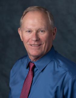 Headshot of APWU Assistant Director Sam Lisenbe