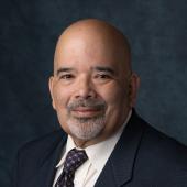 Headshot of APWU National Business Agent Hector Baez