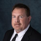 Headshot of APWU National Business Agent Gregory Becker