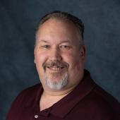 Headshot of APWU National Business Agent Mike Hetticher