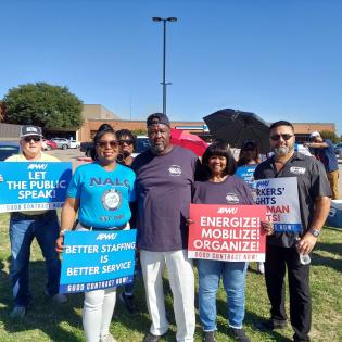 5 people stand in a row holding signs that say better staffing is better service