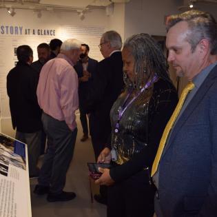 Industrial Relations Director Charlie Cash and National Postal Press Association President Dena Briscoe browse the exhibits