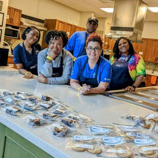 the health plan team poses with their handmade sweets